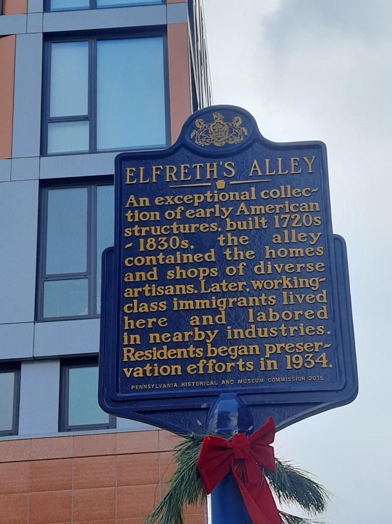 Historical marker for Elfreth's Alley, the oldest continuously inhabited residential street in the United States.