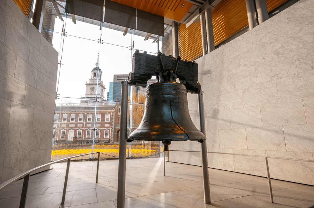 The Liberty Bell displayed inside its glass pavilion in Independence Hall, Philadelphia.